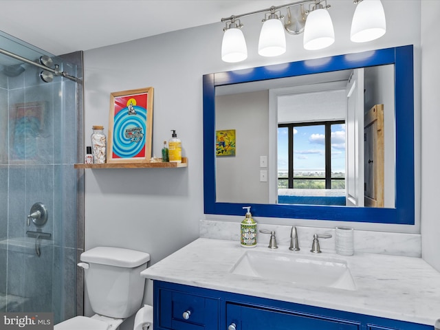 bathroom with walk in shower, vanity, and toilet