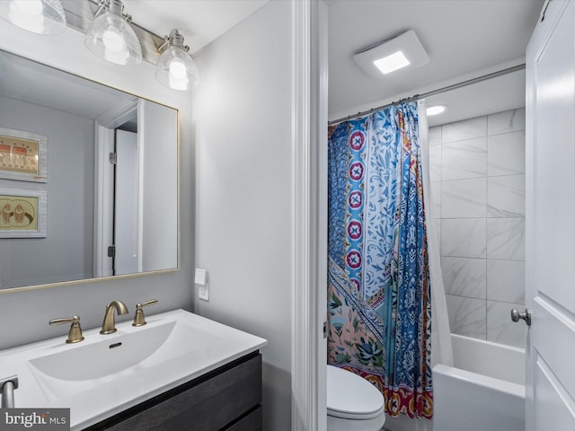 full bathroom featuring toilet, vanity, and shower / tub combo with curtain