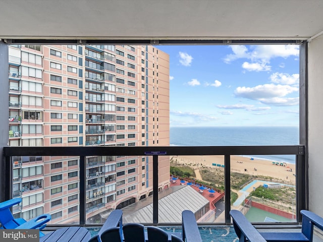 balcony featuring a water view