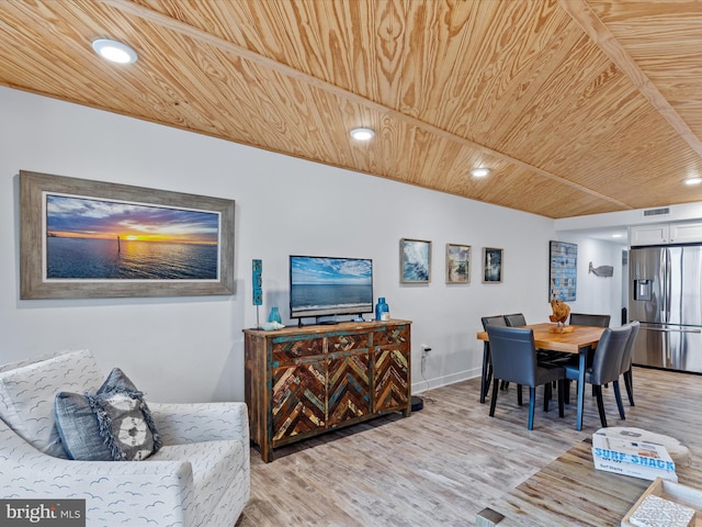 dining room with wooden ceiling and hardwood / wood-style floors