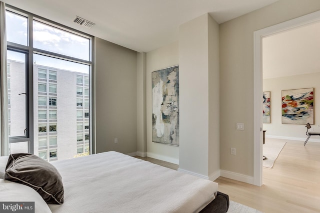 bedroom with light hardwood / wood-style floors