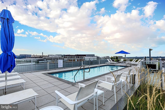 view of swimming pool with a patio area