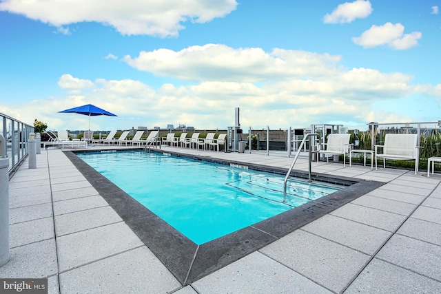 view of swimming pool featuring a patio