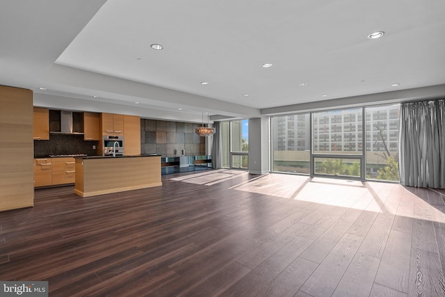 unfurnished living room featuring dark wood-type flooring