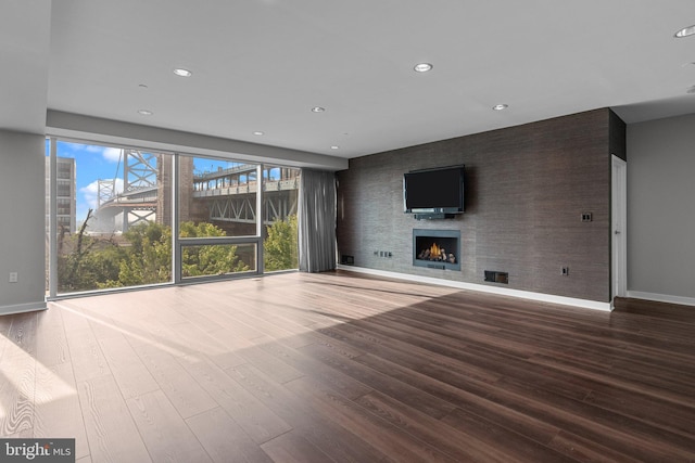 unfurnished living room featuring wood-type flooring