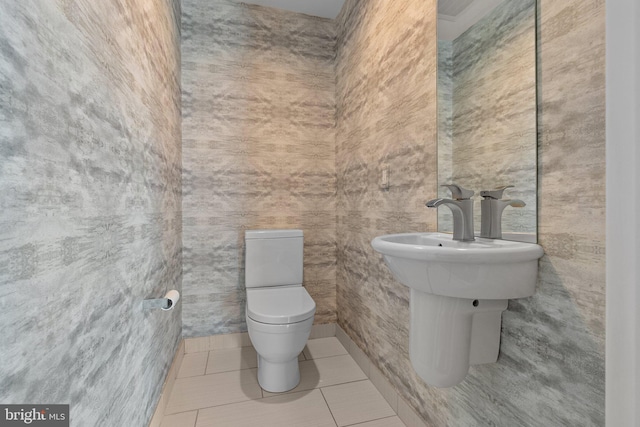 bathroom featuring tile patterned floors and toilet