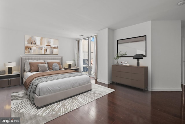 bedroom featuring dark hardwood / wood-style floors