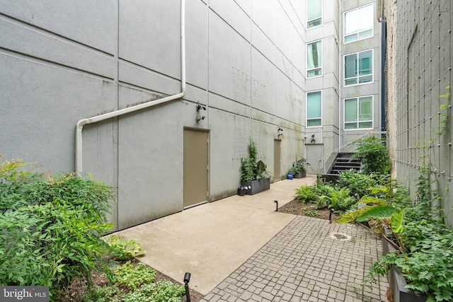 view of side of property featuring a patio area