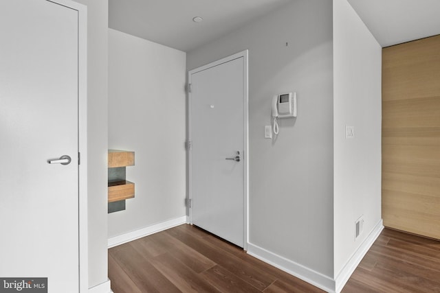 hall featuring dark wood-type flooring