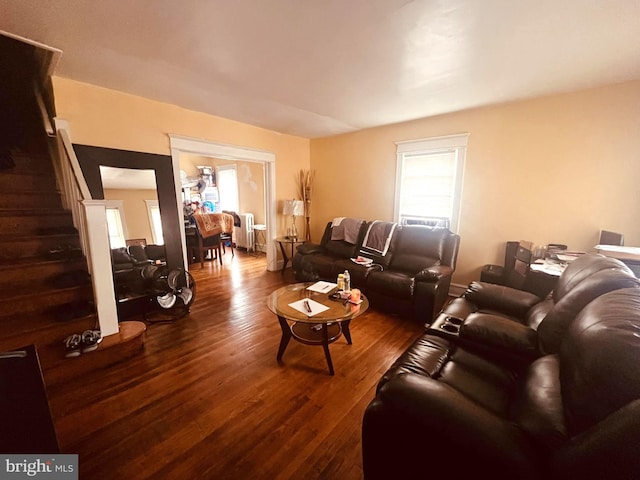 living room with radiator and dark hardwood / wood-style flooring