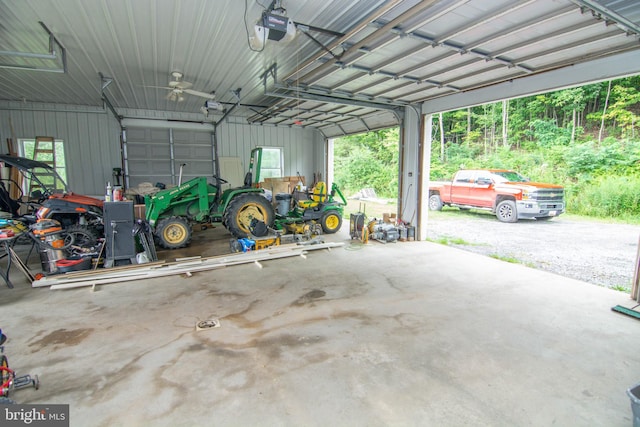 garage featuring a garage door opener and a carport