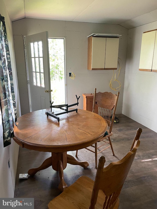 dining area featuring lofted ceiling