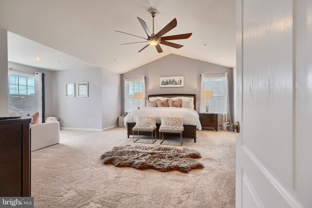 carpeted bedroom with lofted ceiling and ceiling fan