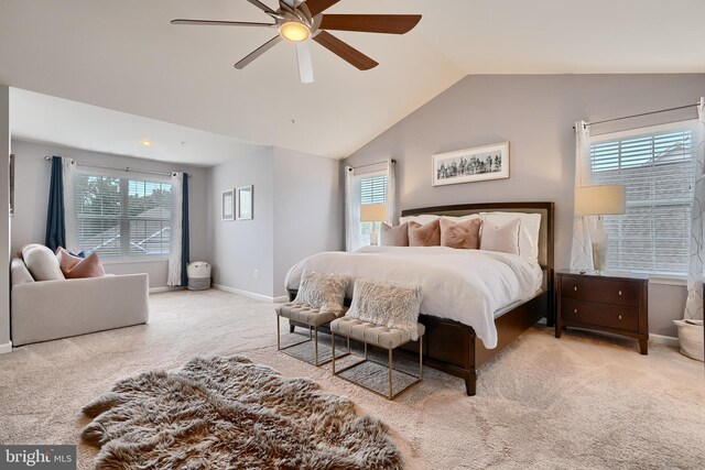 carpeted bedroom with lofted ceiling and ceiling fan