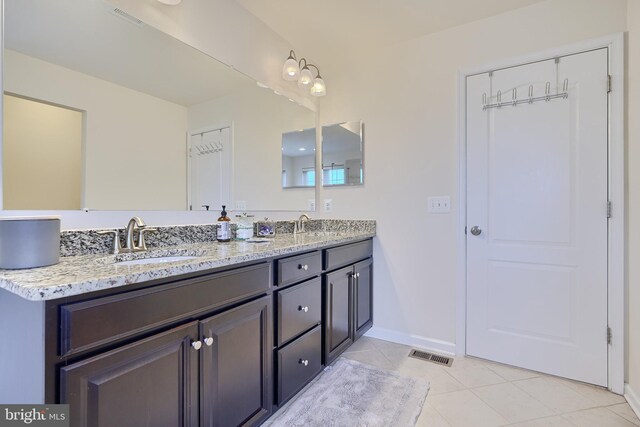 bathroom with vanity and tile patterned floors