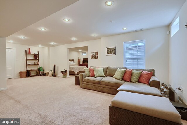 living room with light carpet and a healthy amount of sunlight