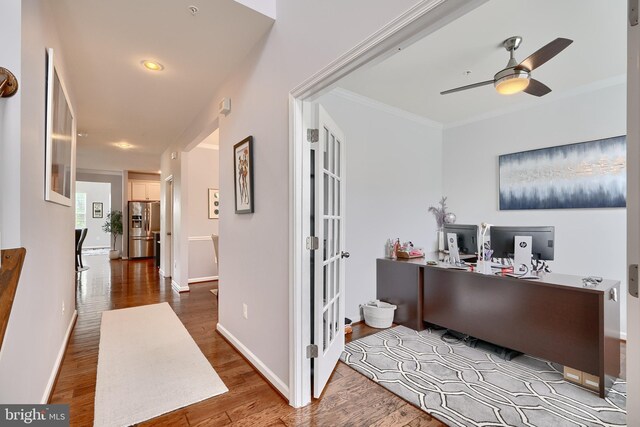 office featuring ceiling fan, ornamental molding, and hardwood / wood-style floors