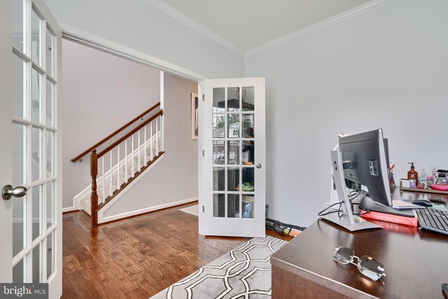 office space featuring ornamental molding, a wealth of natural light, dark wood-type flooring, and french doors