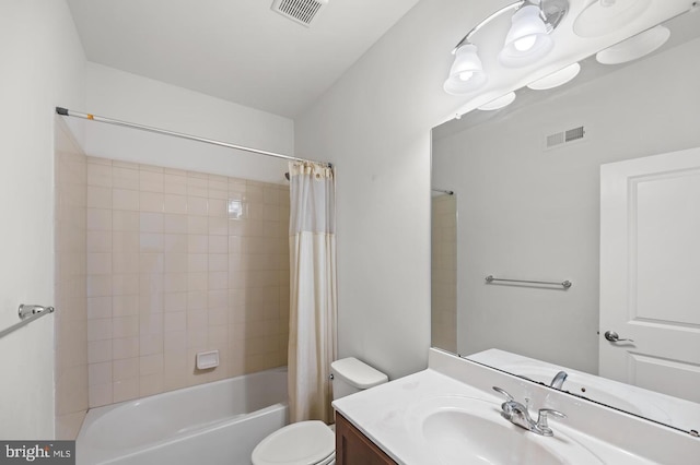 full bathroom featuring toilet, shower / bath combo with shower curtain, and vanity