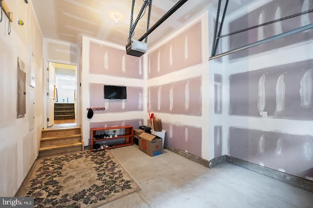 living room with concrete floors and electric panel