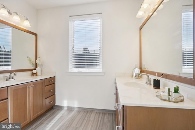 bathroom with vanity and plenty of natural light