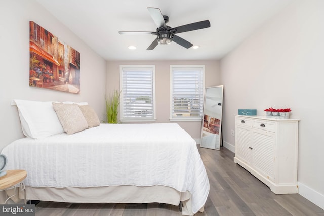 bedroom featuring dark hardwood / wood-style flooring and ceiling fan