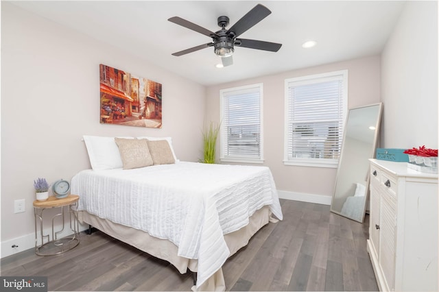 bedroom featuring ceiling fan and dark hardwood / wood-style flooring