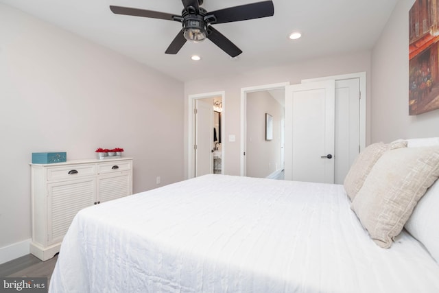 bedroom with ceiling fan and dark wood-type flooring