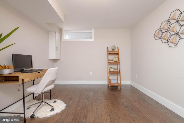 office space with wood-type flooring