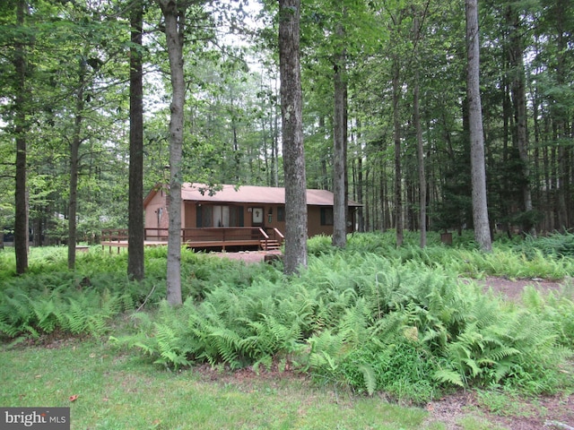 view of front of house featuring a wooden deck