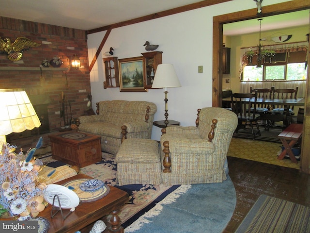 living room featuring crown molding and an inviting chandelier