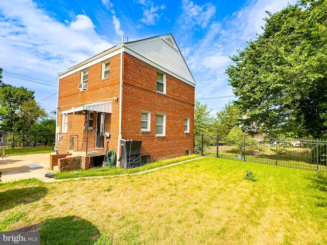 back of house featuring a yard