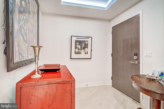 foyer with light hardwood / wood-style floors