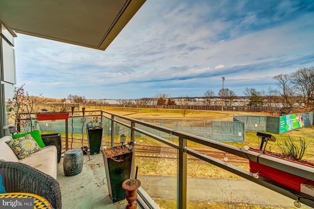 balcony with a rural view and baseboard heating