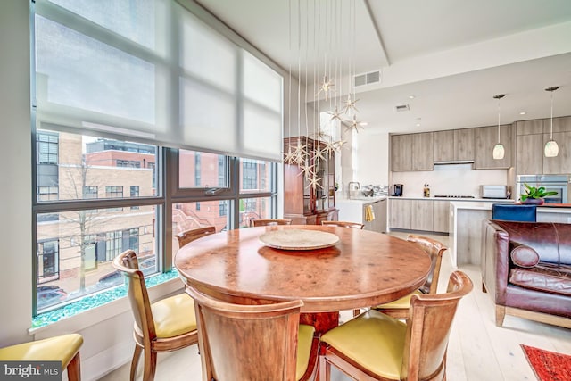 dining room with light wood-type flooring