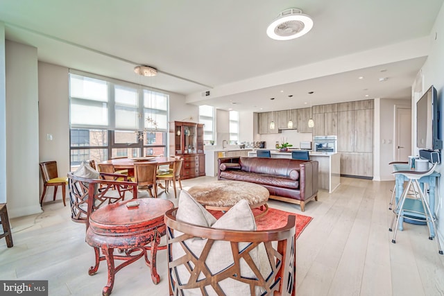 living room with light hardwood / wood-style flooring