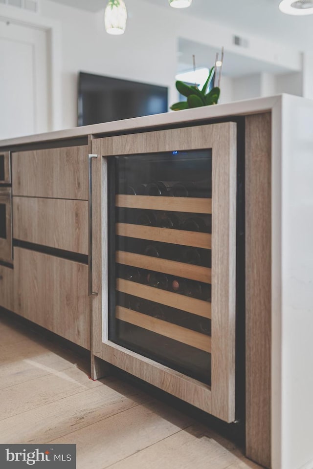 room details featuring wall oven and wine cooler