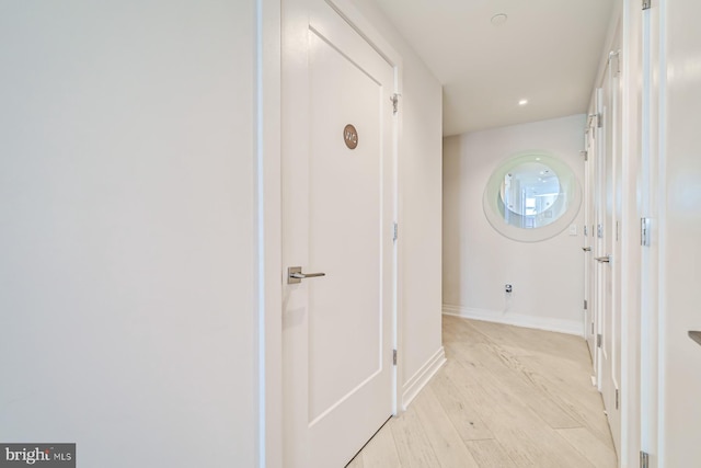 hallway with light wood-type flooring