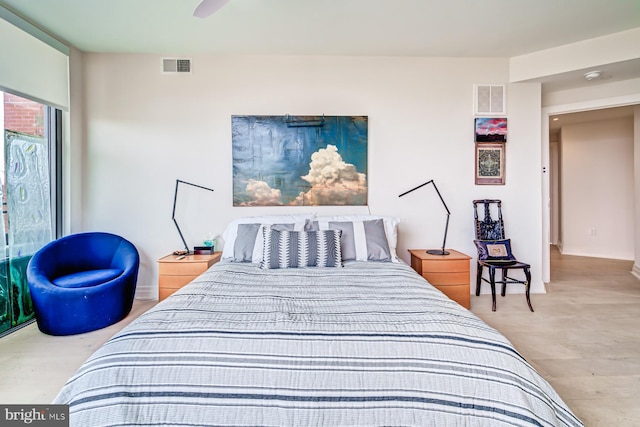 bedroom with hardwood / wood-style flooring and ceiling fan