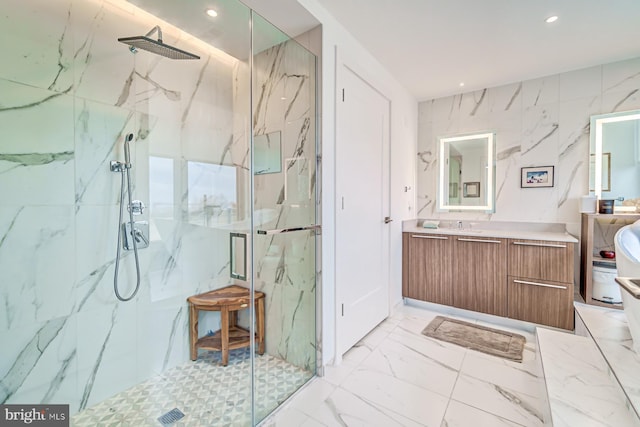 bathroom featuring vanity and an enclosed shower