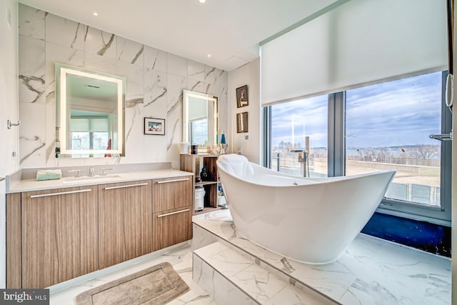 bathroom featuring a bathing tub and vanity