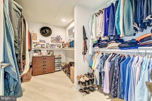 walk in closet featuring light hardwood / wood-style flooring