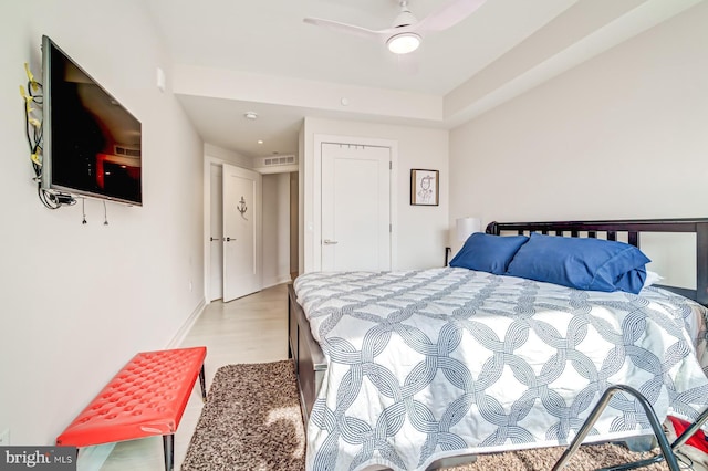 bedroom featuring light wood-type flooring and ceiling fan