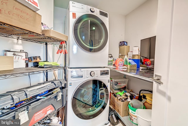 laundry room with stacked washer / dryer