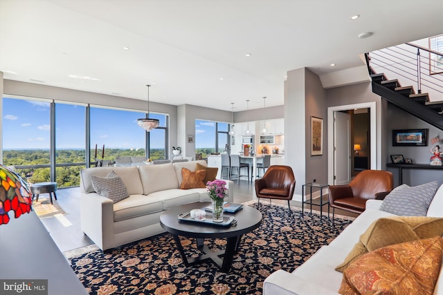 living room featuring a notable chandelier