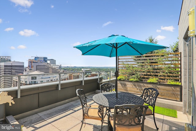 view of patio featuring a balcony