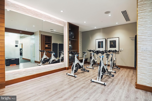 workout area featuring light hardwood / wood-style flooring