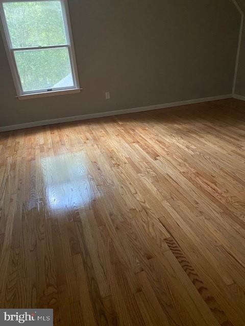 unfurnished room featuring wood-type flooring