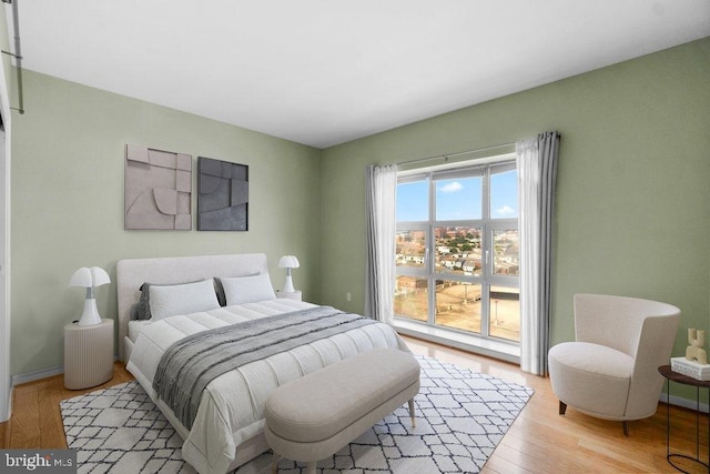 bedroom with light hardwood / wood-style flooring