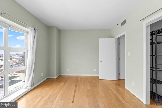 unfurnished bedroom with light hardwood / wood-style floors